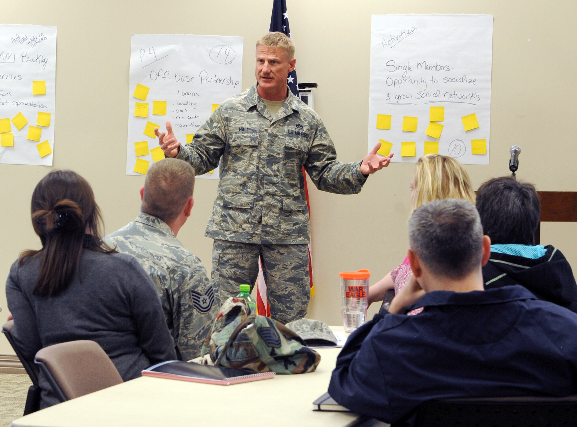 Chief Master Sgt. Craig S. Hall, 460th Space Wing command chief, speaks with the attendees of the Caring for People forum on prominent issues March 28, 2014 at the chapel on Buckley AFB, Colo. The forum was a chance for Team Buckley members to address and share opinions on issues in the local community. (U.S. Air Force photo by Airman Emily E. Amyotte/Released)