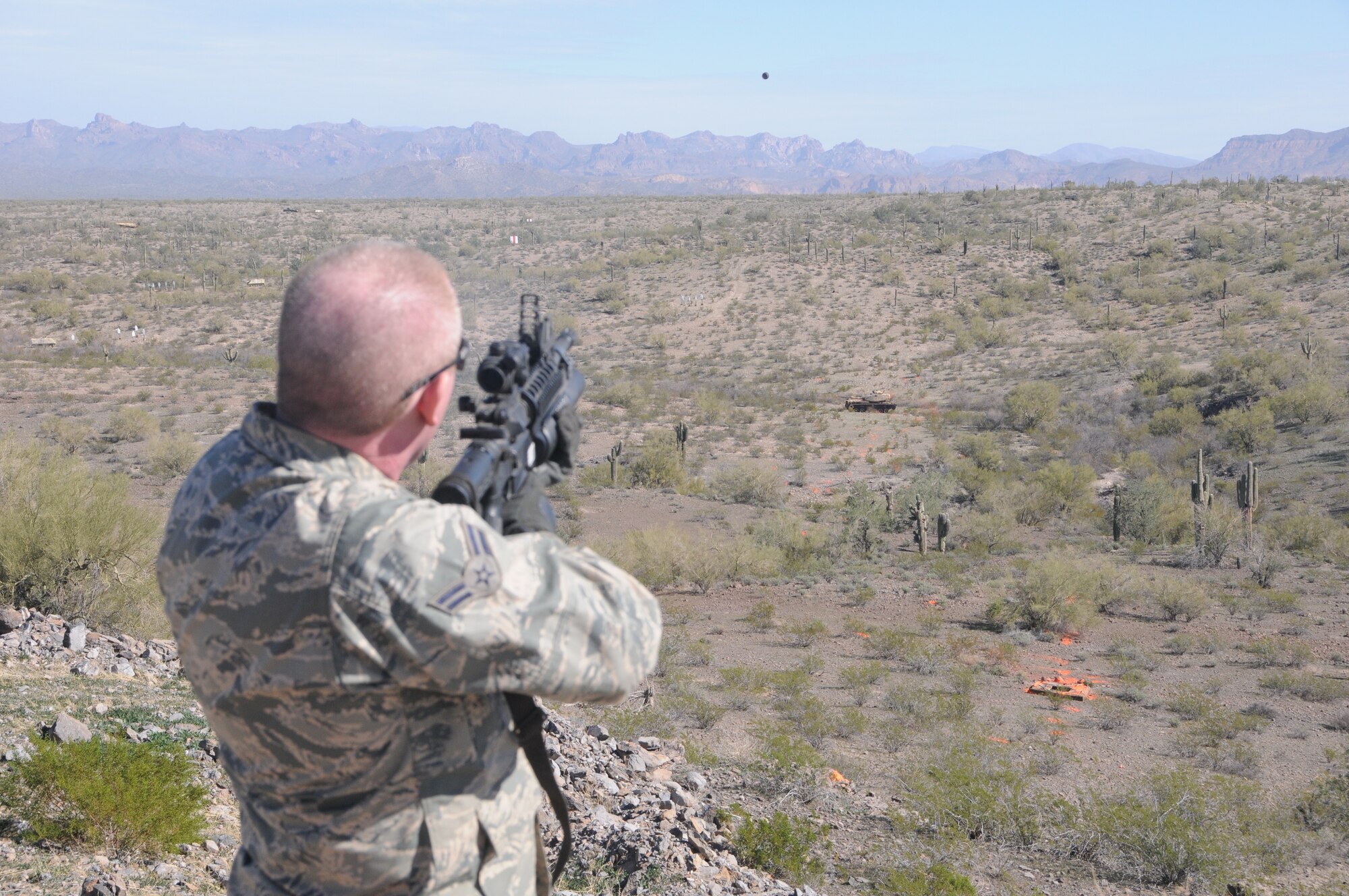 Airmen 1st Class Jason Hines, 185th ARW Security Forces Squadron, fires a M203 Grenade Launcher at a target on a range near Florence, AZ on January 22, 2014. (Officer Air National Guard Photo by 1LT Jeremy McClure/Released)
