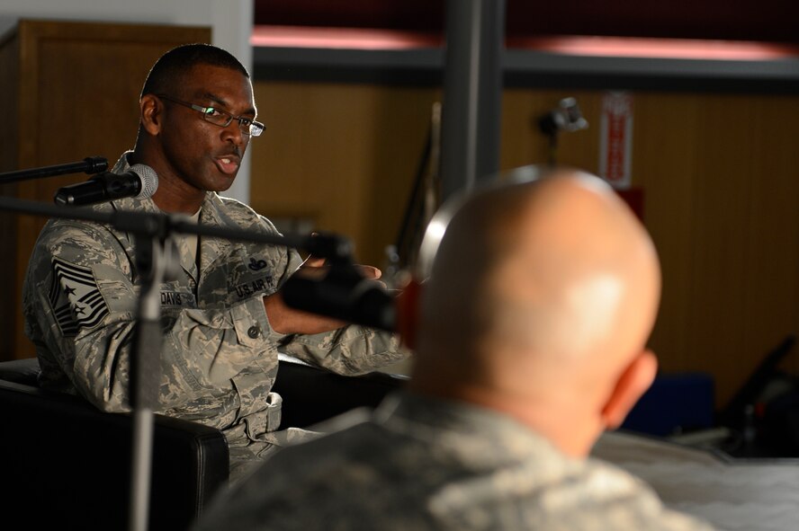 U.S. Air Force Chief Master Sgt. James Davis, U.S. Air Forces in Europe and Air Forces Africa command chief, answers questions from U.S. Air Force Master Sgt. Jason Garo, 52nd Operations Group first sergeant from Virginia Beach, Va., during ‘Inside the Chief’s Office’ March 28, 2014 at Spangdahlem Air Base, Germany. Davis is currently the senior-enlisted advisor to the USAFE-AFAFRICA commander on all matters pertaining to Europe and Africa’s U.S. enlisted members, which totals more than 21,000 people. (U.S. Air Force photo by Staff Sgt. Christopher Ruano/Released)
