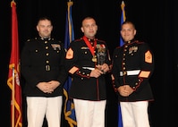 Representing the Marines for award presentations during the Joint Base San Antonio Annual Awards Banquet March 29 are Maj. Martin Gale, left, and Master Sgt. David Villareal, right. Gunnery Sgt. Antonio Lopez, center, from Marine Detachment JBSA-Lackland, received the Senior Enlisted Member of the Year Award. (U.S. Air Force photo by Melissa Peterson)