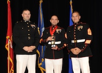Representing the Marines for award presentations during the Joint Base San Antonio Annual Awards Banquet March 29 are Maj. Martin Gale, left, and Master Sgt. David Villareal, right. Staff Sgt. Michael R. Armendariz, center, from the 4th Reconnaissance Battalion, received the NCO of the Year Award. (U.S. Air Force photo by Melissa Peterson)