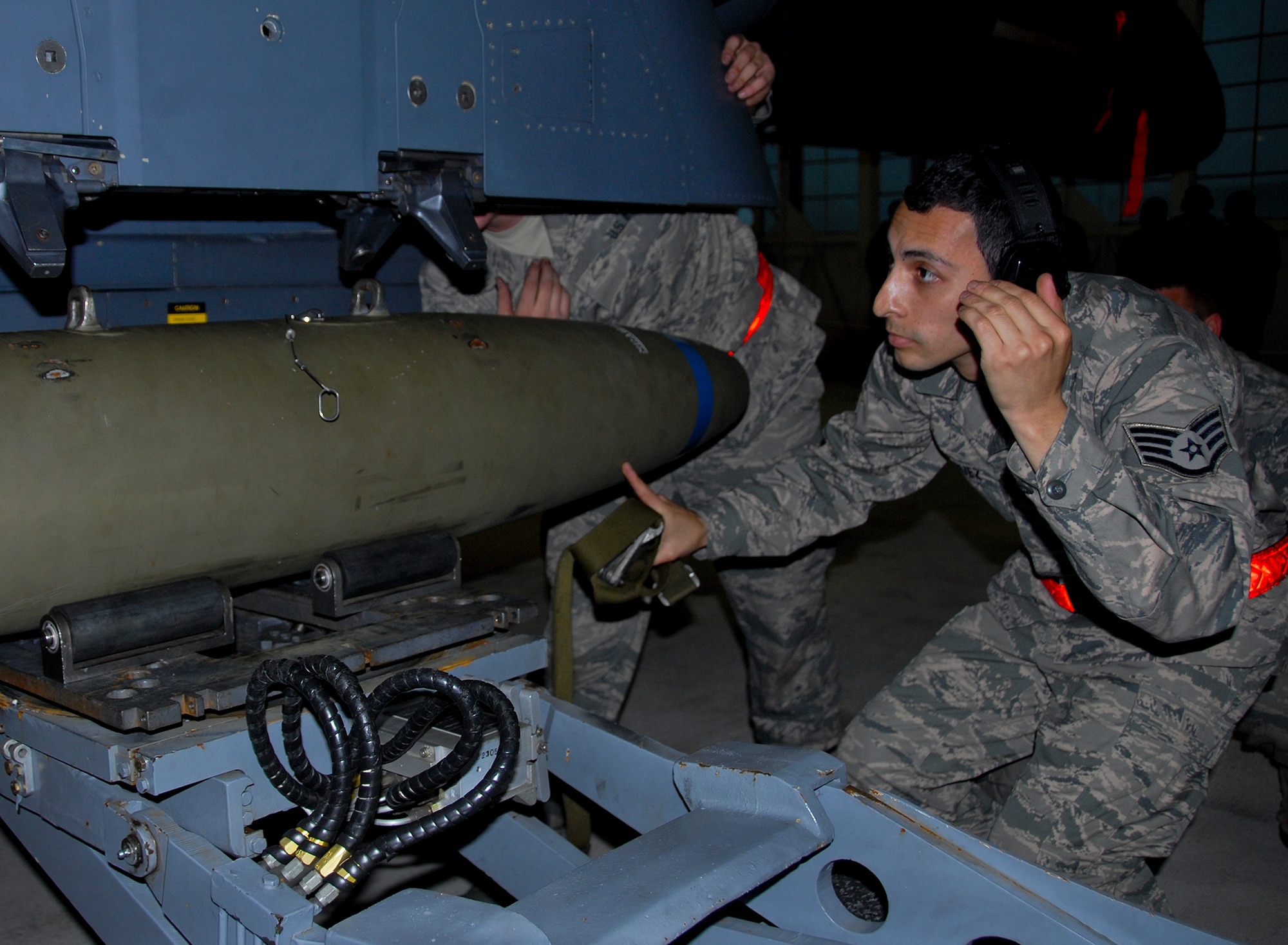 Staff Sgt. Hector Vazquez, of the 96th Aircraft Maintenance Squadron Red, loads an MK-82 500-pound bomb onto the F-15E Strike Eagle, during the 96th Maintenance Group’s quarterly weapons loadcrew competition March 28 at Eglin Air Force Base, Fla.  Vazquez, Airmen 1st Class Aaron Shirk and Devante Walker of the Red AMU, fell to the F-16 Blue AMU team. (U.S. Air Force photo/Kevin Gaddie)