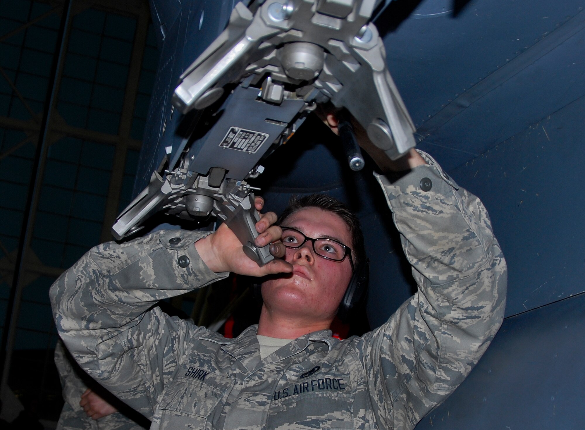 Airman 1st Class Aaron Shirk, of the 96th Aircraft Maintenance Squadron Red, performs Bomb Release Unit-47 bomb rack preparation on the F-15E Strike Eagle, during the 96th Maintenance Group’s quarterly weapons loadcrew competition March 28 at Eglin Air Force Base, Fla.  Shirk, Staff Sgt. Hector Vazquez and Airman 1st Class Devante Walker of the Red AMU team, fell to the F-16 AMU Blue Team. (U.S. Air Force photo/Kevin Gaddie)