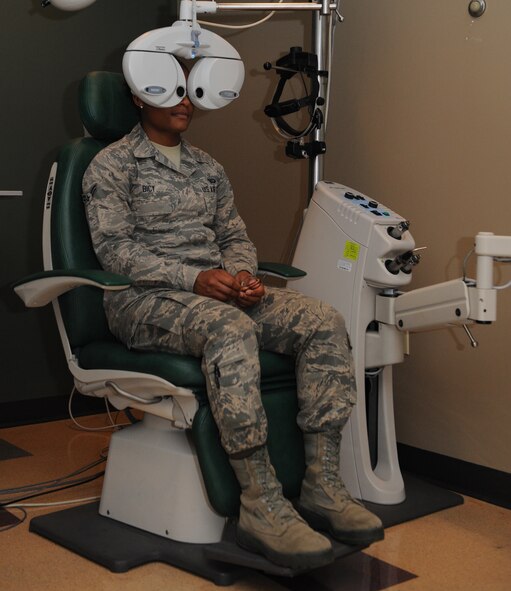 Airman 1st Class Jessica Bicy, 2nd Comptroller Squadron financial services technician, looks through a phoropter during an eye exam on Barksdale Air Force Base, La., March 26, 2014. The phoropter contains different lenses for each eye, which helps the optometrist find the correct prescription for the patient. (U.S. Air Force photo/Senior Airman Benjamin Gonsier)