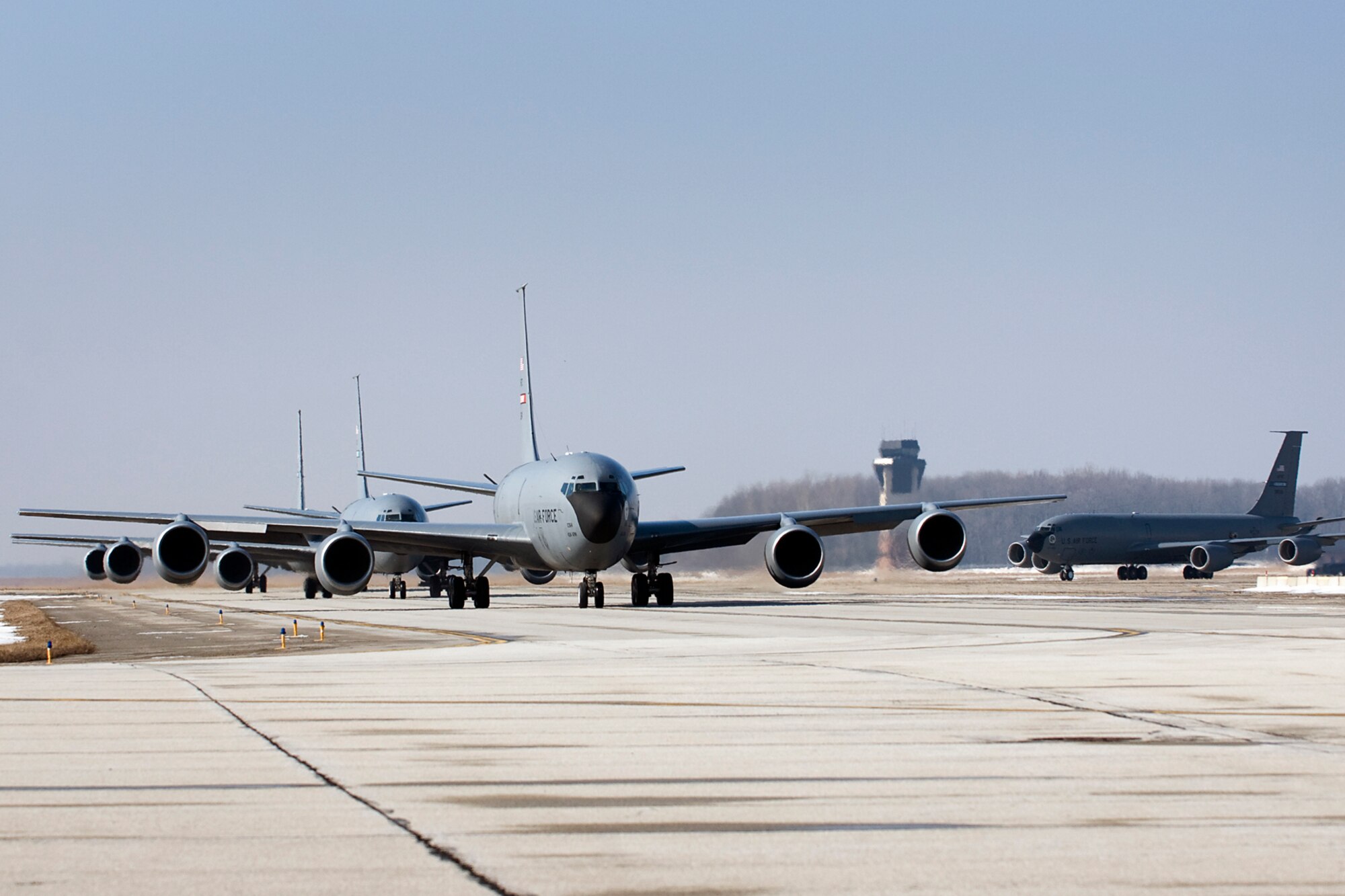 Four 434th Air Refueling Wing KC-135R Stratotankers head down a taxiway at Grissom Air Reserve Base, Ind., March 9, 2014. During the 434th ARW's March unit training assembly, the unit held a strategic warfare exercise, executing various response, mobility, and command and control procedures in response to a simulated global threat, which culminated in 10 Stratotankers taking off in two five-ship formations. (U.S. Air Force photo/Tech. Sgt. Mark R. W. Orders-Woempner)
