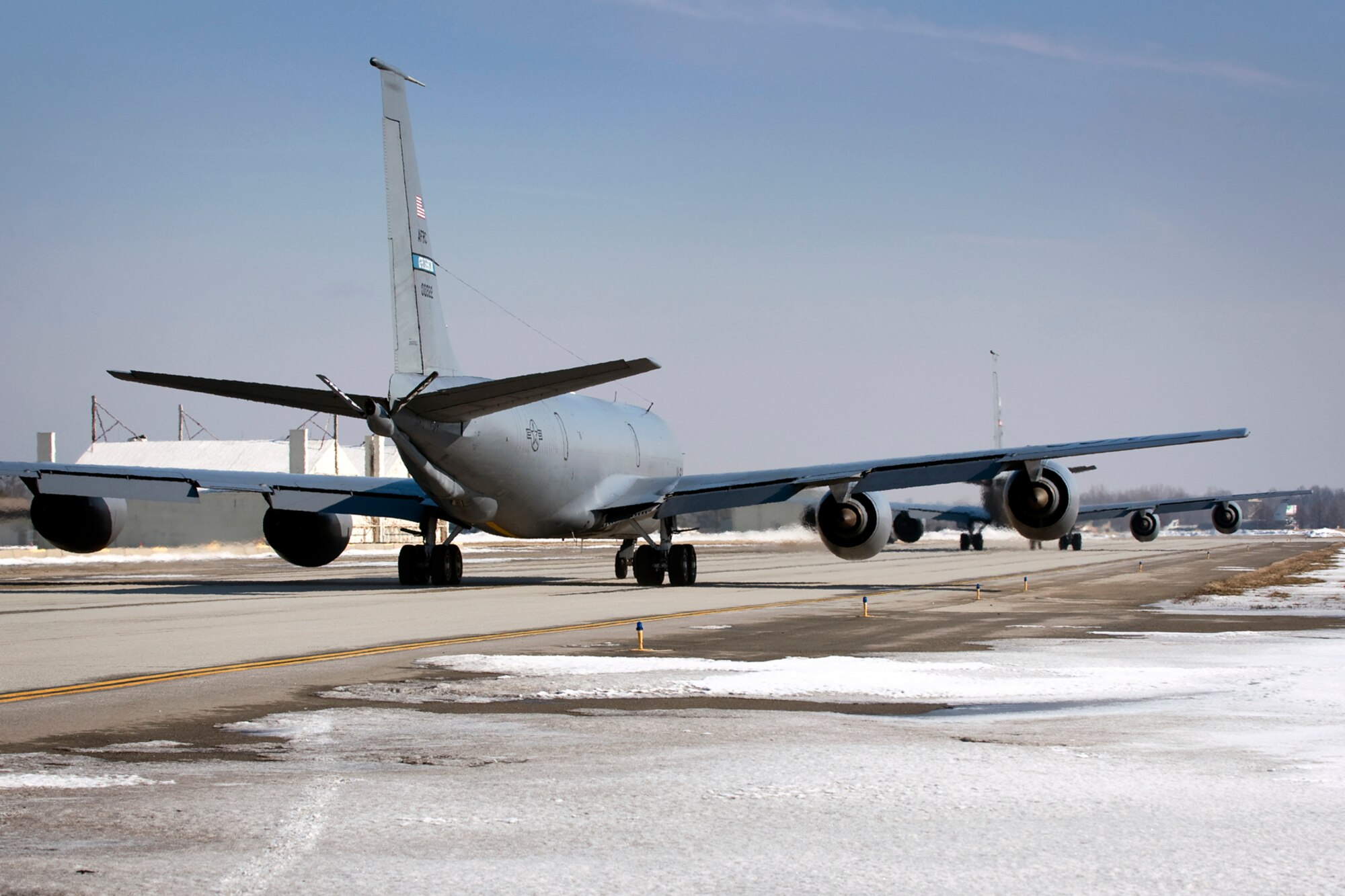 Two 434th Air Refueling Wing KC-135R Stratotankers head down a taxiway at Grissom Air Reserve Base, Ind., March 9, 2014. During the 434th ARW's March unit training assembly, the unit held a strategic warfare exercise, executing various response, mobility, and command and control procedures in response to a simulated global threat, which culminated in 10 Stratotankers taking off in two five-ship formations. (U.S. Air Force photo/Tech. Sgt. Mark R. W. Orders-Woempner)
