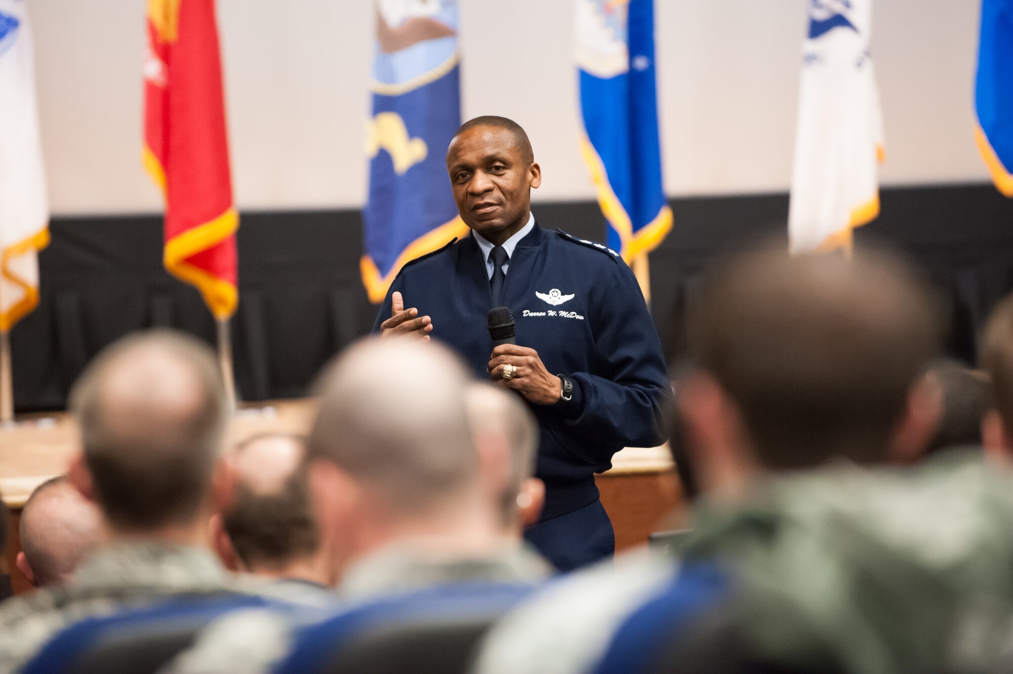 Lt. Gen. Darren W. McDew,18th Air Force commander, hosts an 18th Air Force all-call Mar. 26, 2014, at the McGuire Theater, Joint Base McGuire-Dix-Lakehurst, N.J. McDew answered various questions regarding the current fiscal environment and Air Force force shaping programs. The all-call occurred during McDew’s two-day visit to JB MDL where he visited the 305th Air Mobility Wing and various mission partners throughout JB MDL. (U.S. Air Force photo by Russ Meseroll/Released)