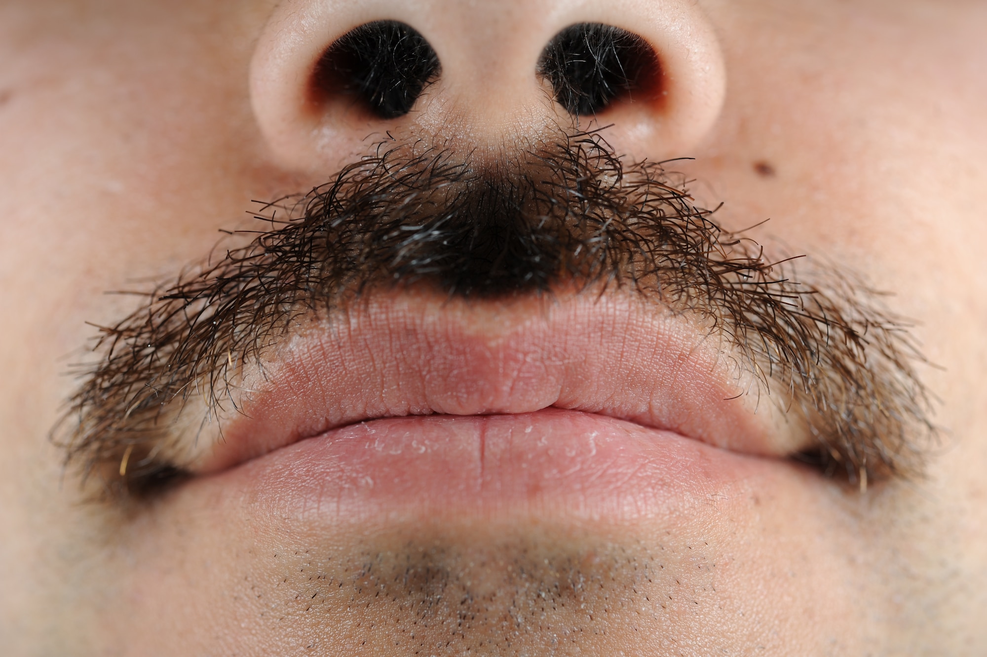 Senior Airman Michael Alanis, 436th Civil Engineer Squadron firefighter, participated in Mustache March March 26, 2014, at Dover Air Force Base, Del. Growing a March mustache has been encouraged throughout Dover AFB. (U.S. Air Force photo/Airman 1st Class Zachary Cacicia)