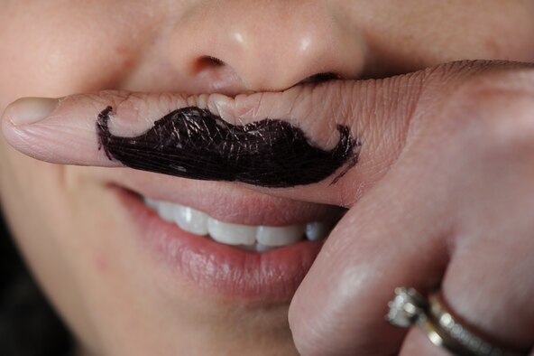 Capt. Kelley Hursh, 436th Dental Squadron general dentist, participated in Mustache March March 26, 2014, at Dover Air Force Base, Del. Hursh, unphased by the fact she was unable to grow a mustache, decided to partake in the event anyhow. (U.S. Air Force photo/Airman 1st Class Zachary Cacicia)