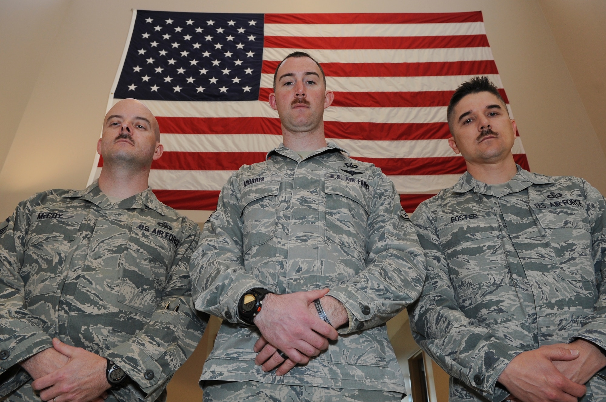 Master Sgt. Bryan McCoy, Staff Sgt. Clayton Morris, and Master Sgt. Anthony Foster from 436th Operational Support Squadron aircrew flight equipment section show off their whiskers that were grown for Mustache March, March 27, 2014, at Dover Air Force Base, Del. Gen. Mark A. Welsh III, Air Force Chief of Staff, recently laid down an Air Force-wide Mustache March challenge. (U.S. Air Force photo/Airman 1st Class Zachary Cacicia)