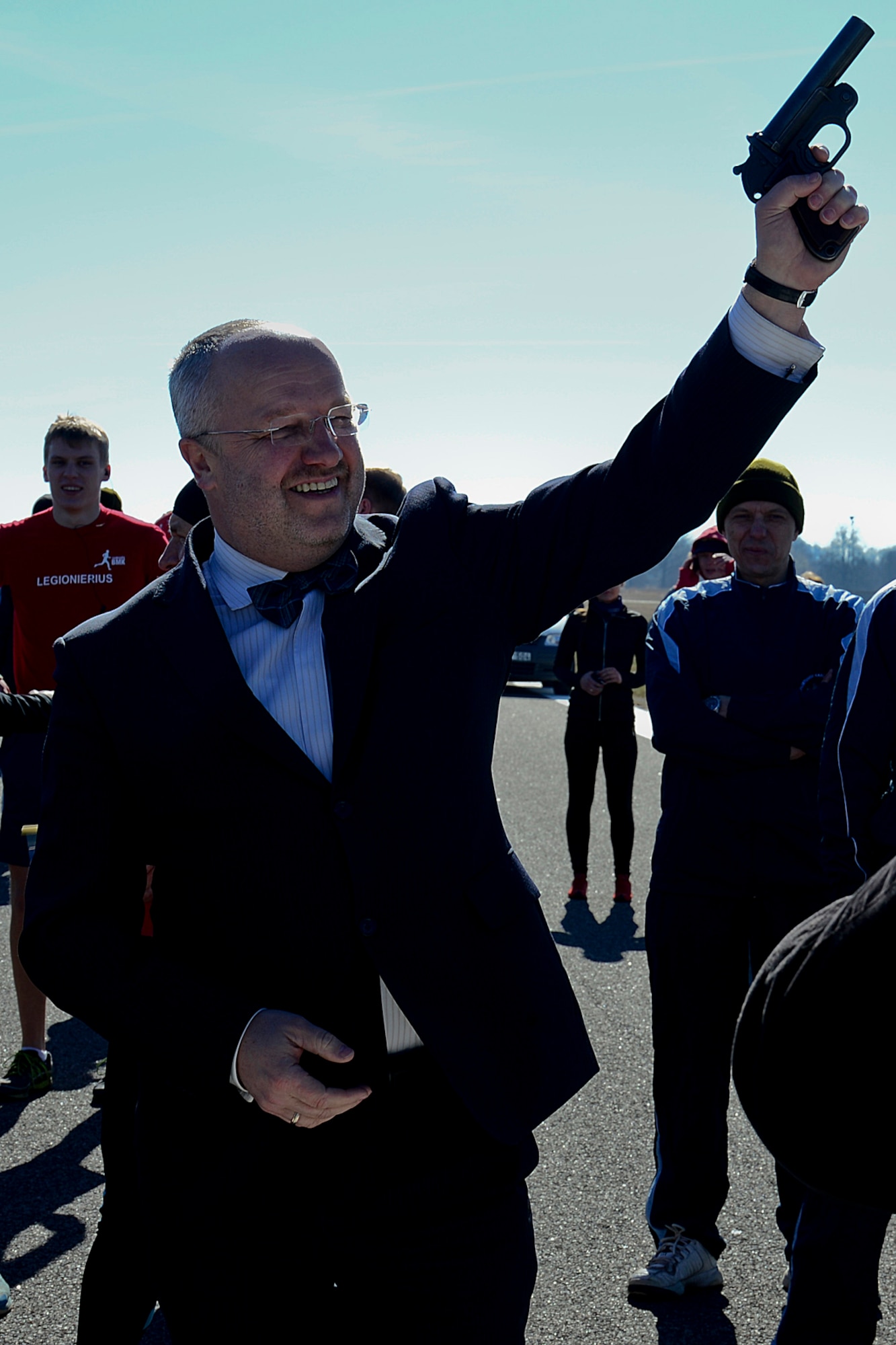 Juozas Olekas, Lithuanian Minister of National Defence, signals the start of ‘Runway Run 2014,’ which kicked off events celebrating the 10-year anniversary of Lithuania joining NATO and the Baltic Air Policing mission at Šiauliai Air Base, Lithuania, March 28, 2014. For the past 10 years, air forces from across NATO have shared the responsibility of patrolling the skies over Estonia, Latvia and Lithuania contributing to a safe and stable future. (U.S. Air Force photo by Airman 1st Class Dana J. Butler/Released)