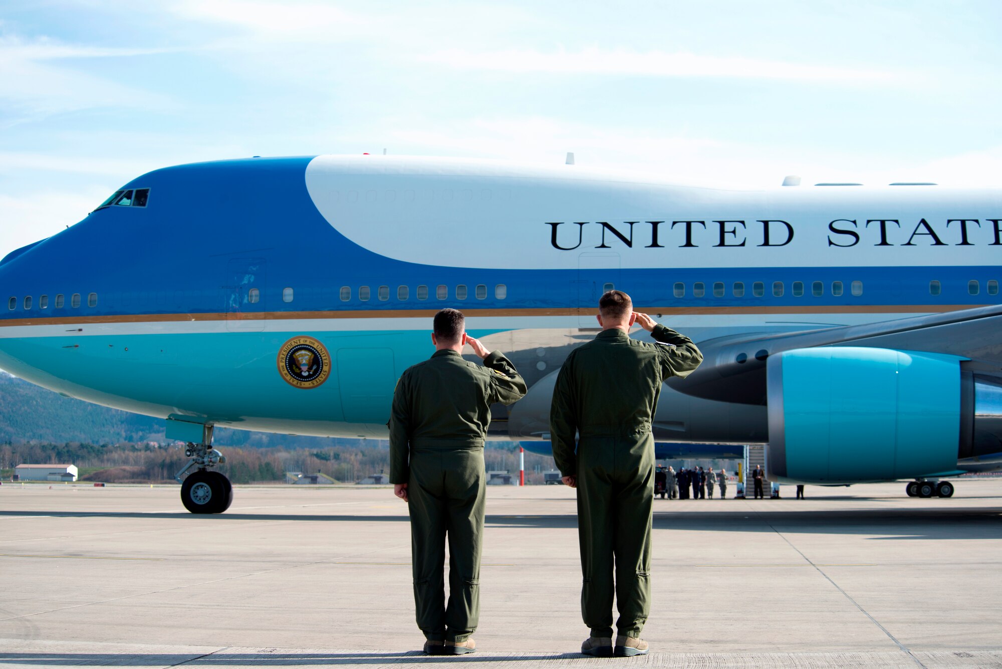 Gen. Frank Gorenc (right), U.S. Air Forces in Europe and Air Forces Africa commander and Brig. Gen. Patrick X. Mordente, 86th Airlift Wing commander, salute Air Force One as President Barack Obama departs March 29, 2014, at Ramstein Air Base Germany. During his stop, Obama visited wounded warriors from Landstuhl Regional Medical Center. (U.S. Air Force photo/Senior Airman Damon Kasberg)