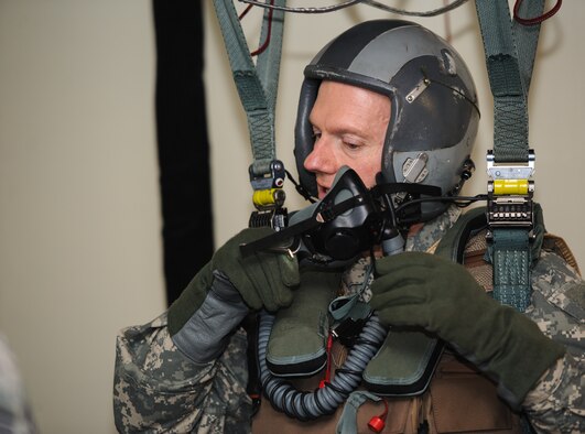 U.S. Army Command Sgt. Maj. John Troxell, United States Forces Korea command sergeant major, removes his mask during Survival, Evasion, Resistance and Escape training at Kunsan Air Base, Republic of Korea Mar. 27, 2014. Troxell was preparing to view the Wolf Pack mission from the air during a familiarization flight.  Troxell visited with Kunsan’s Airmen and saw how the Wolf Pack stays prepared and ready to fight tonight both on the ground and in the air. (U.S. Air Force photo by Senior Airman Armando A. Schwier-Morales/Released)