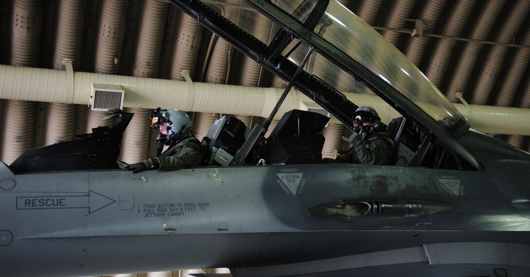 U.S. Army Command Sgt. Maj. John Troxell, United States Forces Korea command sergeant major, right, gives a 35th Fighter Squadron “Push it Up” before seeing first-hand how the Wolf Pack completes their mission at Kunsan Air Base, Republic of Korea, Mar. 28, 2014. Troxell visited with Kunsan’s Airmen and saw how the Wolf Pack stays prepared and ready to fight tonight both on the ground and in the air. (U.S. Air Force photo by Senior Airman Armando A. Schwier-Morales/Released)