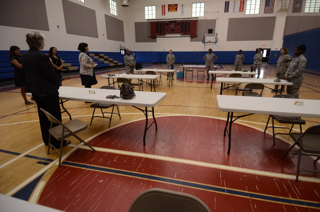 Dr. Mary Katherine Fegurgur, University of Guam professor (center), introduces herself to other mentors during the speed mentoring event March 20, 2014, on Andersen Air Force Base, Guam. Members of Team Andersen gathered and met with accomplished professional leaders residing on Guam, both military and civilian, for a session of speed mentoring, based on the concept of speed dating. (U.S. Air Force photo by Airman 1st Class Emily A. Bradley/Released)