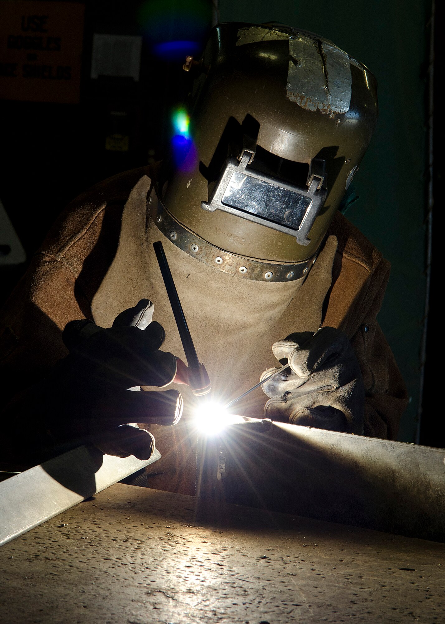 Antonio Malanum, 36th Civil Engineer Squadron sheet metal mechanic, welds the side of a panel March 25, 2014, on Andersen Air Force Base, Guam. 36th CES Airmen plan, construct, maintain and repair wooden, masonry and concrete structures, including concrete footings, foundations, walls, floor slabs, piers and columns. (U.S. Air Force photo by Senior Airman Katrina M. Brisbin/Released)