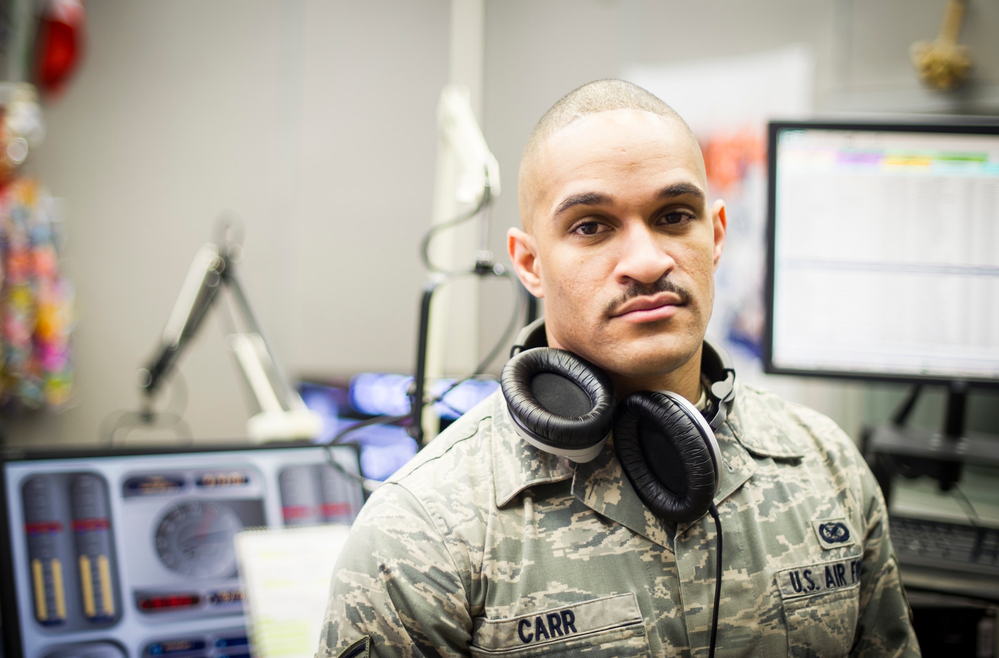 Senior Airman Kellen Carr, American Forces Network broadcaster, participates in mustache March at Yokota Air Base, Japan, March 28, 2014. Mustache March is annual event occurring in the month of March, where men in the United States Air Force grow mustaches to honor Air Force legend General Robin Olds. (U.S. Air Force photo by Staff Sgt. Stacy Moless)