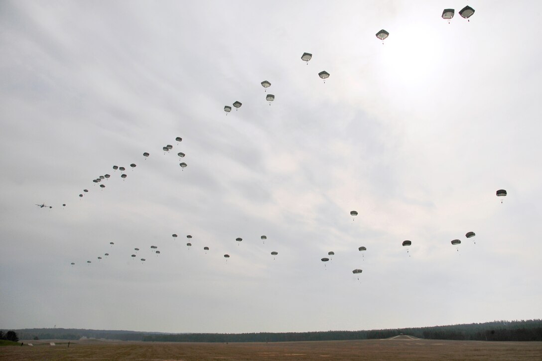 U.S. paratroopers jump into Bunker drop zone during a combined-arms, live-fire exercise at the 7th Army Joint Multinational Training Command's Grafenwoehr and Hohenfels training areas in Germany, March 28, 2014.