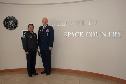 General Shigeru Iwasaki, Chief of Staff, Joint Staff Japanese Self Defense Forces, and Lt. Gen. John W. "Jay" Raymond, Joint Functional Component Command for Space and 14th Air Force commander, pose for a photo inside the 14th AF Headquarters Building, April 1, 2014, Vandenberg Air Force Base, Calif. General Iwasaki, his wife and members of his senior staff visited Vandenberg to learn more about the mission of the 14th Air Force and 30th Space Wing. (U.S. Air Force Photo/Michael Peterson)