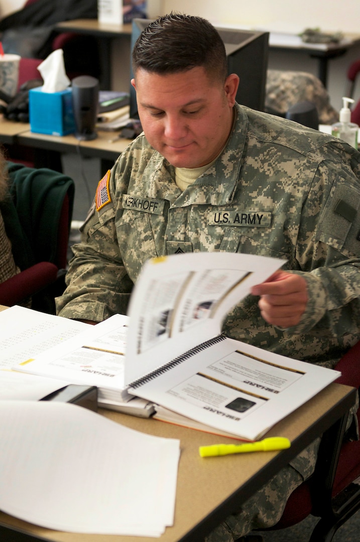 Sgt. 1st Class Michael Kerkhoff, New Mexico National Guard, reviews coursework from a  Sexual Harassment/Assault Response and Prevention course at the District of Columbia National Guard's Regional Training Institute at Fort Belvoir, Va., March 4, 2014. The eight-week pilot program aims to prepare participants to instruct the 80-hour SHARP course to victim advocates.