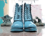 Boots painted teal, the color representing sexual assault awareness and prevention, are lined up in the atrium of the Army National Guard Readiness Center in Arlington, Va. Sexual Assault Awareness Month (SAAM) was first observed nationally in April 2001.
