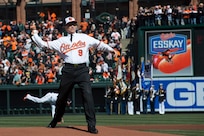 Vice Chairman of the Joint Chiefs of Staff Adm. James A. Winnefeld, Jr., throws out the ceremonial first pitch at Camden Yards in Baltimore, Mar. 31, 2014. Winnefeld is the nation’s second highest-ranking military officer.