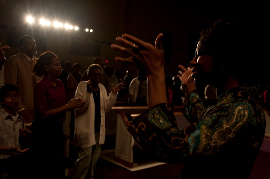 Airman 1st Class Shaney Scott translates her church’s sermon in American Sign Language March 23, 2014, in Montgomery, Ala. She regularly volunteers to teach others at Maxwell Air Force Base, Gunter Annex and in the local community how to sign. Scott is a 690th Network Support Squadron enterprise service desk technician. (U.S. Air Force photo/Staff Sgt. Natasha Stannard)
 