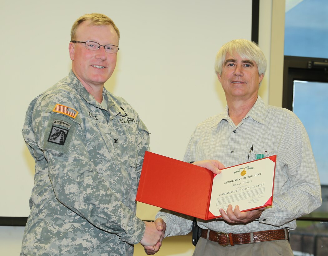 Walters is shown in photo accepting Commander’s Award for Civilian Service from COL John W. Cross, Commander of the Vicksburg District.