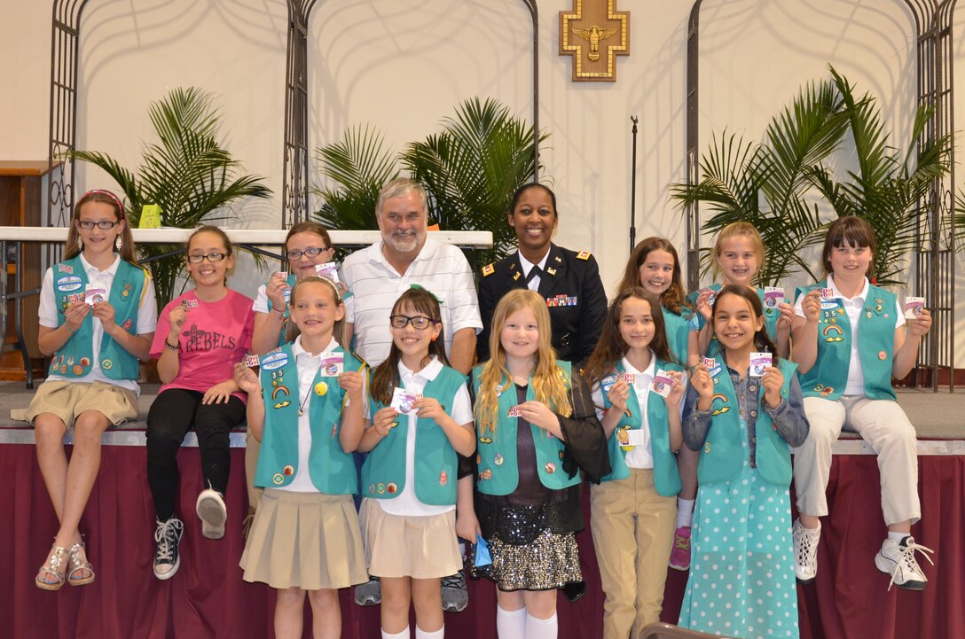 ALBUQUERQUE, N.M., -- Lt. Col. Gant, commander, Albuquerque District, U.S. Army Corps of Engineers Corps, and Kurt Wagener, field engineer for the Albuquerque Metropolitan Arroyo Flood Control Authority with the Girl Scout Troop #35 as they display their new badges, March 22, 2014.