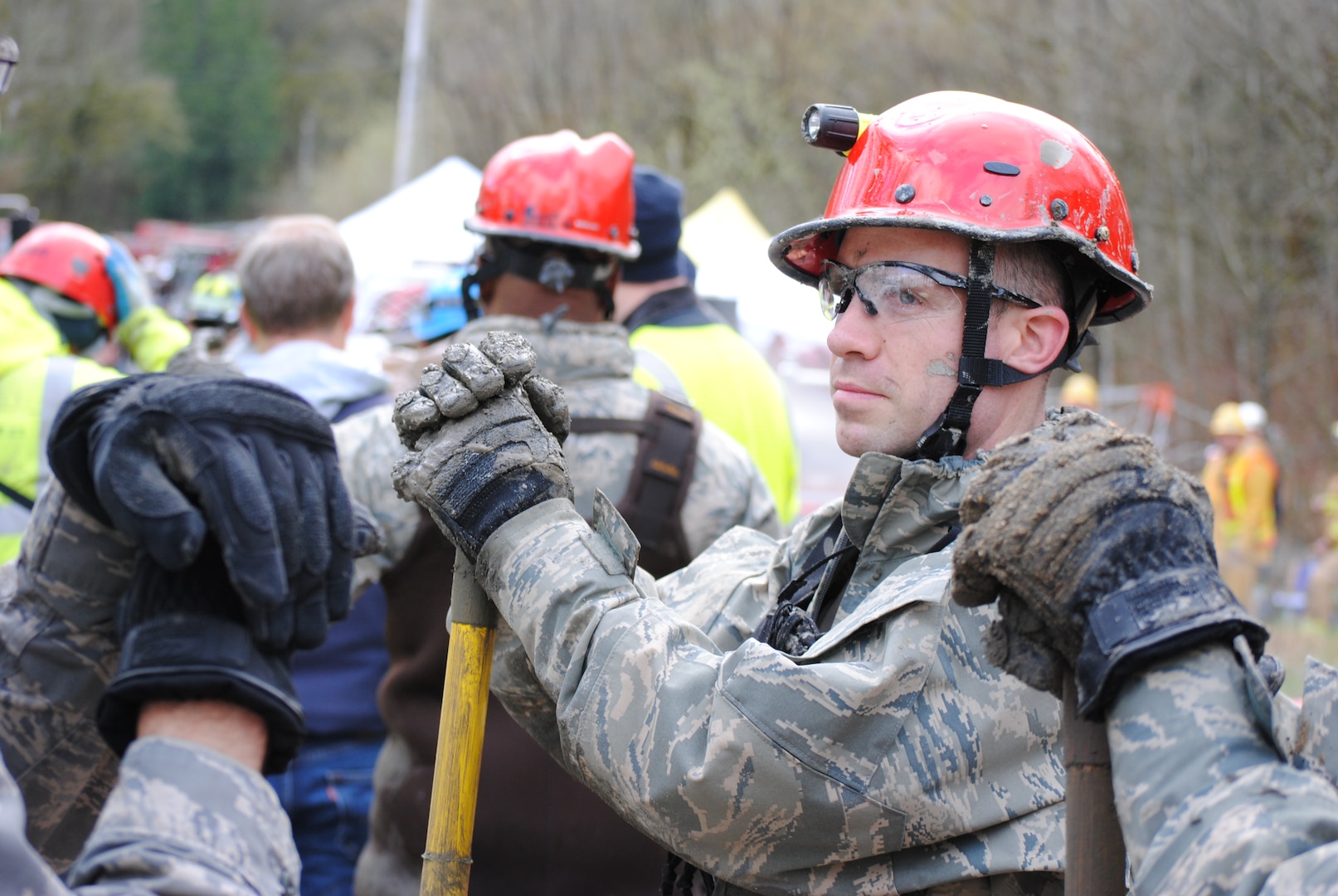 Members of the Washington National Guard continue a grid-based surface search from the west side of the Oso landslide. More than 70 members of the National Guard are involved in search and recovery efforts.