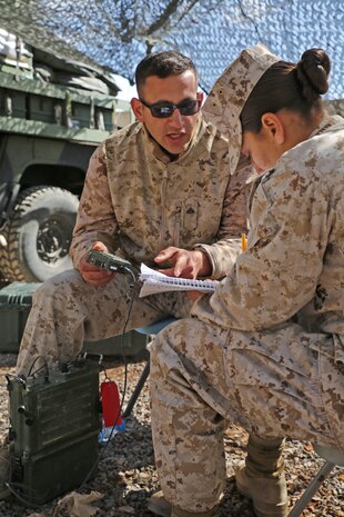 Cpl. Manpreet Singh, the 2nd Marine Expeditionary Brigade radio chief and native of New York City, gives a class on programming frequency-hopping networks to Lance Cpl. Bernadette Olave, from Mesa, Ariz., March 31, 2014. The communication Marines continue to train while in a deployed environment to improve their proficiency. Exercise African Lion 14 showcases the 2nd Marine Expeditionary Brigade’s ability to integrate with partner-nation militaries and respond to crisis or contingency within the U.S. Africa Command operational area under a scalable, expeditionary joint-task force of multiple U.S. service components.