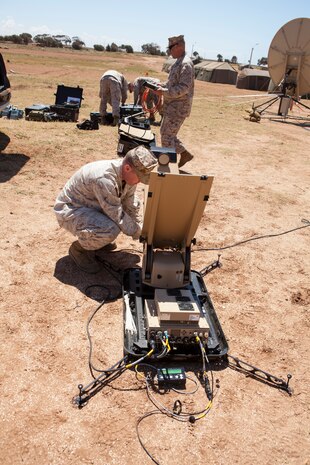 U.S. Marines with Satellite Operations, 2nd Marine Expeditionary Brigade, II Marine Expeditionary Force take apart a Rapid Response Kit during execrise African Lion 2014 on Tifnit Royal Moroccan Armed Forces Base in Agadir, Morocco, Mar. 29, 2014. African Lion is conducted as a combined joint exercise between the Kingdom of Morocco and the U.S. Forces to strengthen relationships and military operability in the region.