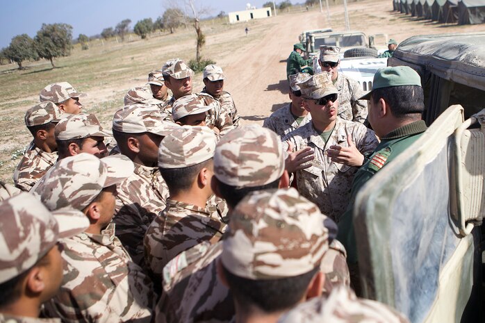 U.S. service members and members of the Royal Moroccan Armed Forces conduct non-lethal weapons training during Exercise African Lion 2014 on the Tifmit Royal Moroccan Armed Forces Base in Morocco, Mar. 27, 2014. African Lion is conducted as a combined-joint execrise between the Kingdom of Morocco and the U.S. Forces to strengthen relationships and military operability in the region. (U.S. Marine Corps photo by Cpl. Alexanria Blanche, 2D MARDIV COMCAM/Not Released)