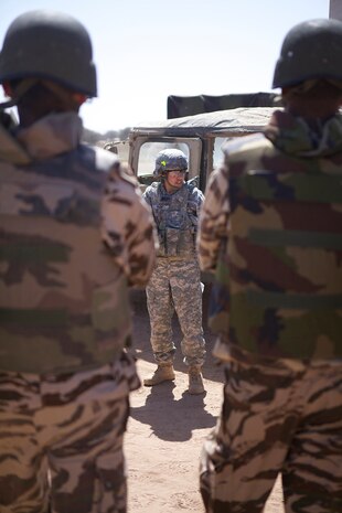 U.S. service members and members of the Royal Moroccan Armed Forces conduct non-lethal weapons training during Exercise African Lion 2014 on the Tifmit Royal Moroccan Armed Forces Base in Morocco, Mar. 27, 2014. African Lion is conducted as a combined-joint execrise between the Kingdom of Morocco and the U.S. Forces to strengthen relationships and military operability in the region. (U.S. Marine Corps photo by Cpl. Alexanria Blanche, 2D MARDIV COMCAM/Not Released)