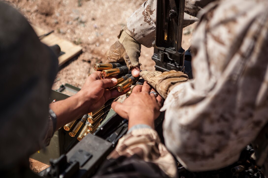 A member, left, of the Royal Moroccan Armed Forces (Far) and a U.S. Marine with 2nd Law Enforcement Battalion, 2nd Marine Expeditionary Brigade, II Marine Expeditionary Force load a M107 .50-caliber Special Applications Scoped Rifle during a live fire training exercise as part of exercise African Lion 2014 on Tifnit FAR Base in Agadir, Morocco, Mar. 29, 2014. African Lion is conducted as a combined joint exercise between the Kingdom of Morocco and the U.S. Forces to strengthen relationships and military operability in the region. (U.S. Marine Corps Photo by Cpl. Alexandria Blanche, 2D MARDIV COMCAM/Released)