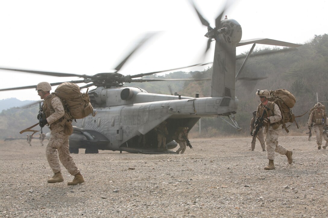 U.S. Marines exit CH-53E Super Stallion helicopters as part of the vertical assault raid portion of exercise Ssang Yong 2014 at Su Seong-Ri Range in Pohang, Republic of Korea March 31. Ssang Yong demonstrates the ROK-U.S. Navy and Marine Corps’ responsive amphibious and expeditionary capabilities from the sea. Forward-deployed and forward-based U.S. Marine forces, in conjunction with U.S. allies, have the unique ability to provide rapid force deployment for the full range of military operations, specifically in the Pacific region. The Marines are with Company C, Battalion Landing Team 1st Battalion, 4th Marine Regiment, 13th Marine Expeditionary Unit (U. S. Marine Corps photo by Sgt. Anthony J. Kirby/Released)