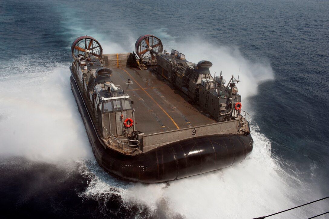 140402-N-LM312-030 EAST CHINA SEA (April 2, 2014) - Landing Craft Air Cushion (LCAC) 9, assigned to Naval Beach Unit 7, prepares to enter the well deck of the forward-deployed amphibious assault ship USS Bonhomme Richard (LHD 6). Bonhomme Richard is assigned to Expeditionary Strike Group Seven and is participating in Exercise Ssang Young, an annual combined exercise conducted by Navy and Marine forces with the Republic of Korea in order to strengthen interoperability across the range of military operations. (U.S. Navy photo by Mass Communication Specialist 2nd Class Adam D. Wainwright/Released)