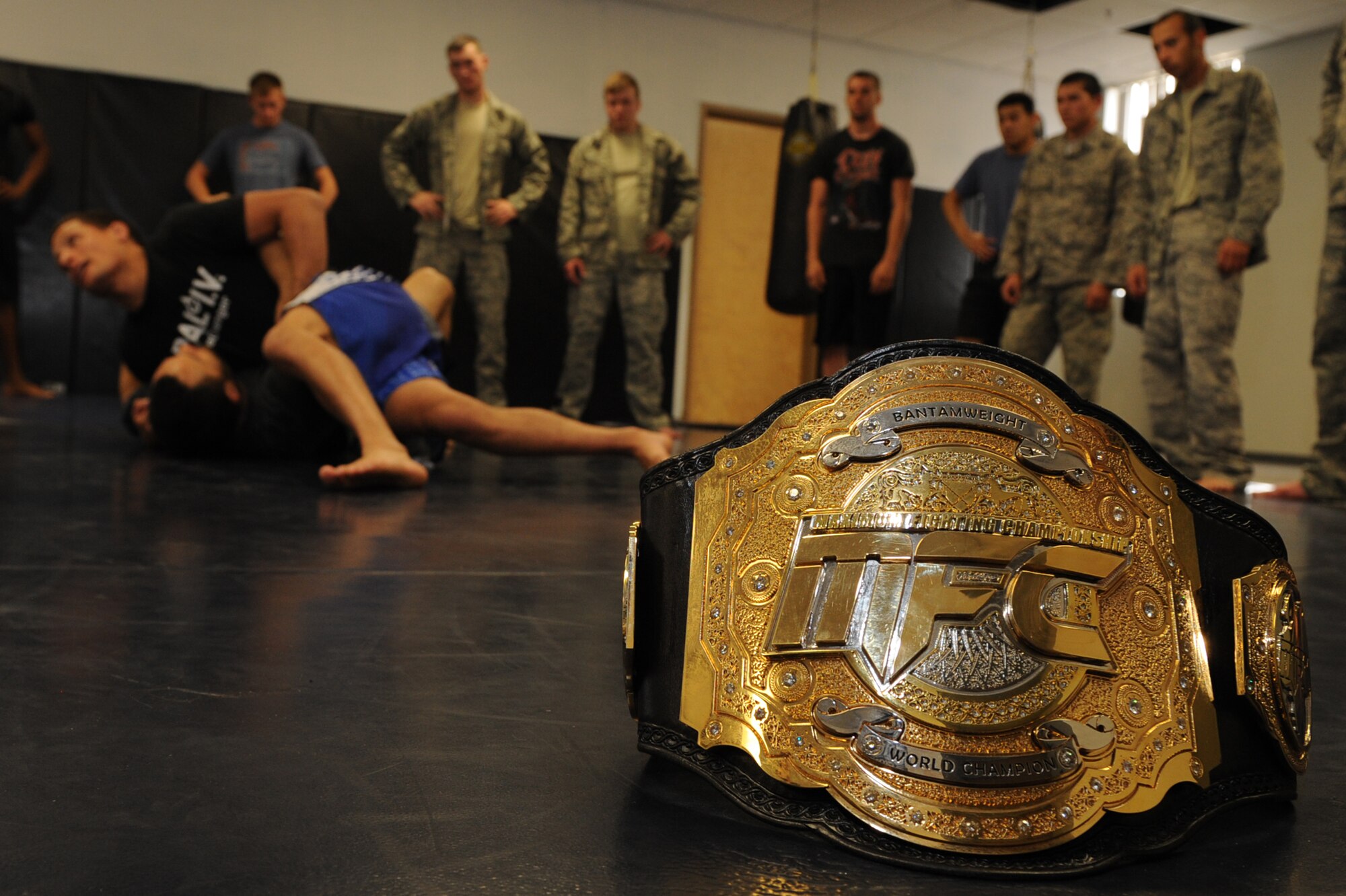 The Maximum Fighting Championship Bantamweight World Championship belt lays idle during a combatives seminar at Davis-Monthan Air Force Base, Ariz., March 30, 2014. The seminar was unique because it included mixed martial arts instruction from Anthony Birchak, the MFC Bantamweight World Champion. (U.S. Air Force photo by Airman 1st Class Chris Drzazgowski/Released)