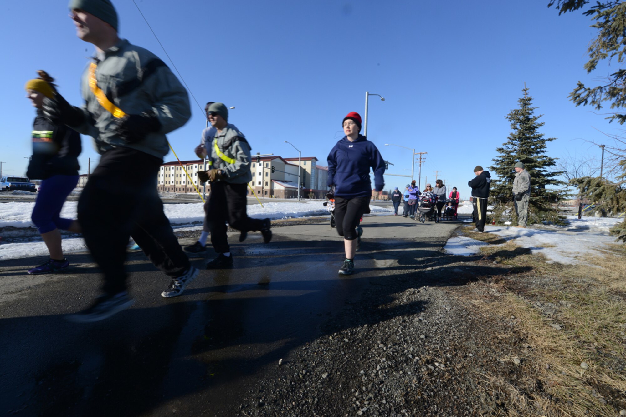 JOINT BASE ELMENDORF-RICHARDSON, Alaska--Volunteers participate in the annual Dirty Shoe Run at the Buckner Physical Fitness Center running track on Joint Base Elmendorf-Richardson, Alaska, April 1, 2014. More than Twenty-five service members, spouses and Department of Defense employees participated in the five-kilometer event. (U.S. Air Force photo/Airman 1st Class Ty-Rico Lea)