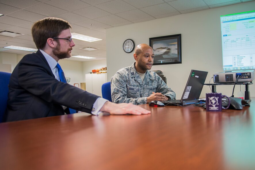 Capt. Stephen Cash, 62nd Comptroller Squadron deputy Financial Analysis Flight commander, demonstrates for Dr. Jamie Morin, the Assistant Secretary of the Air Force for Financial Management and Comptroller, the newly-implemented Defense Enterprise Accounting and Management System April 2, 2014, at Joint Base Lewis-McChord, Wash. DEAMS is a new financial management system being implemented throughout the Air Force in order to comply with audit readiness mandates. (U.S. Air Force photo by Tech. Sgt. Sean Tobin)