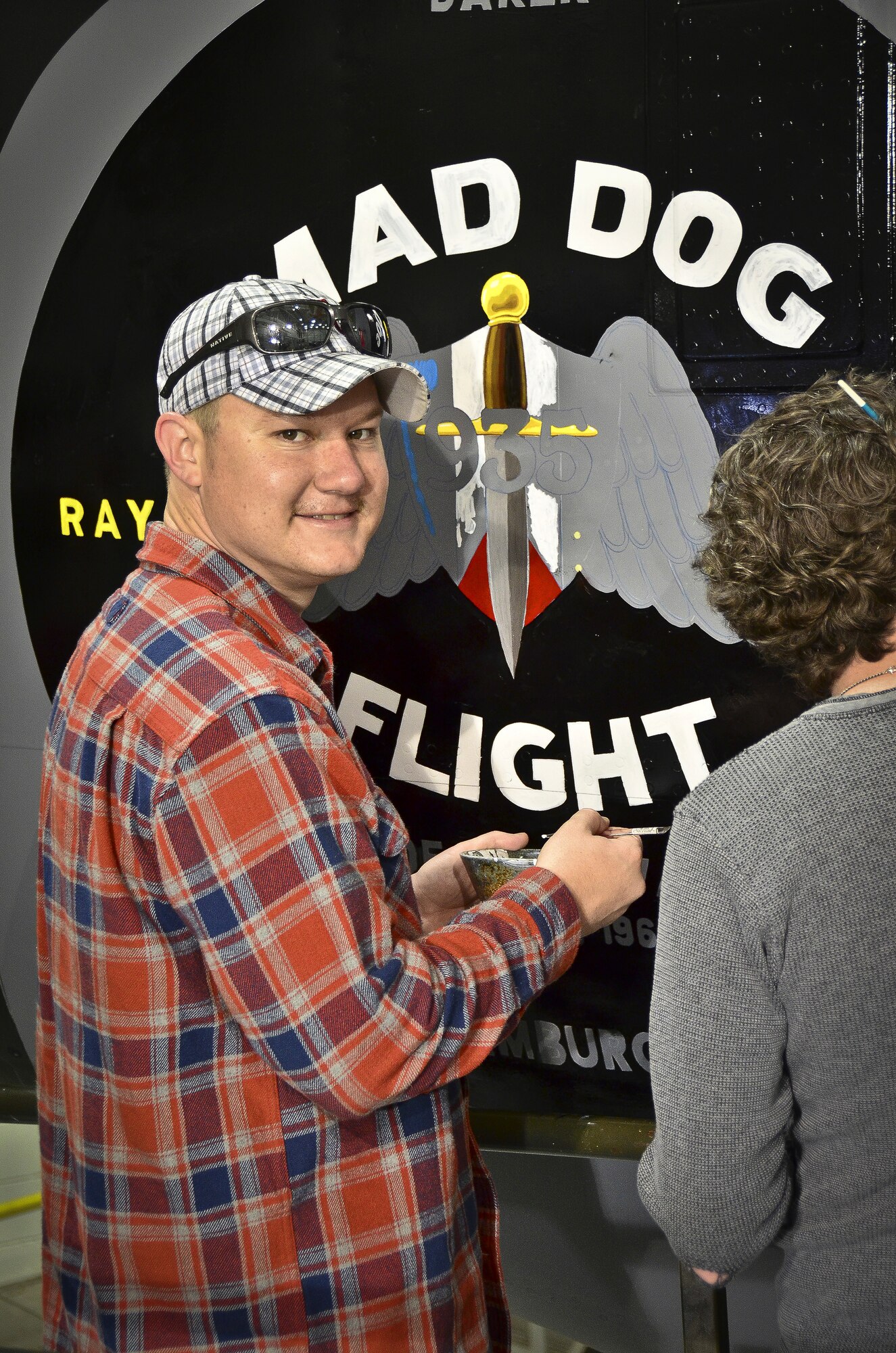 Tech. Sgt. Aaron Sharit, a crew chief from the 117th Maintenance Group paints nose art on a KC-135R commemorating the 117th Air Refueling Wing's participation in the 1961 Bay of Pigs operation. The design, created by Sharit, was inspired by a combination of logos and graphics that were used on some of the aircraft during the invasion.  (U.S. Air National Guard photo by Master Sgt. Ken Johnson/Released)