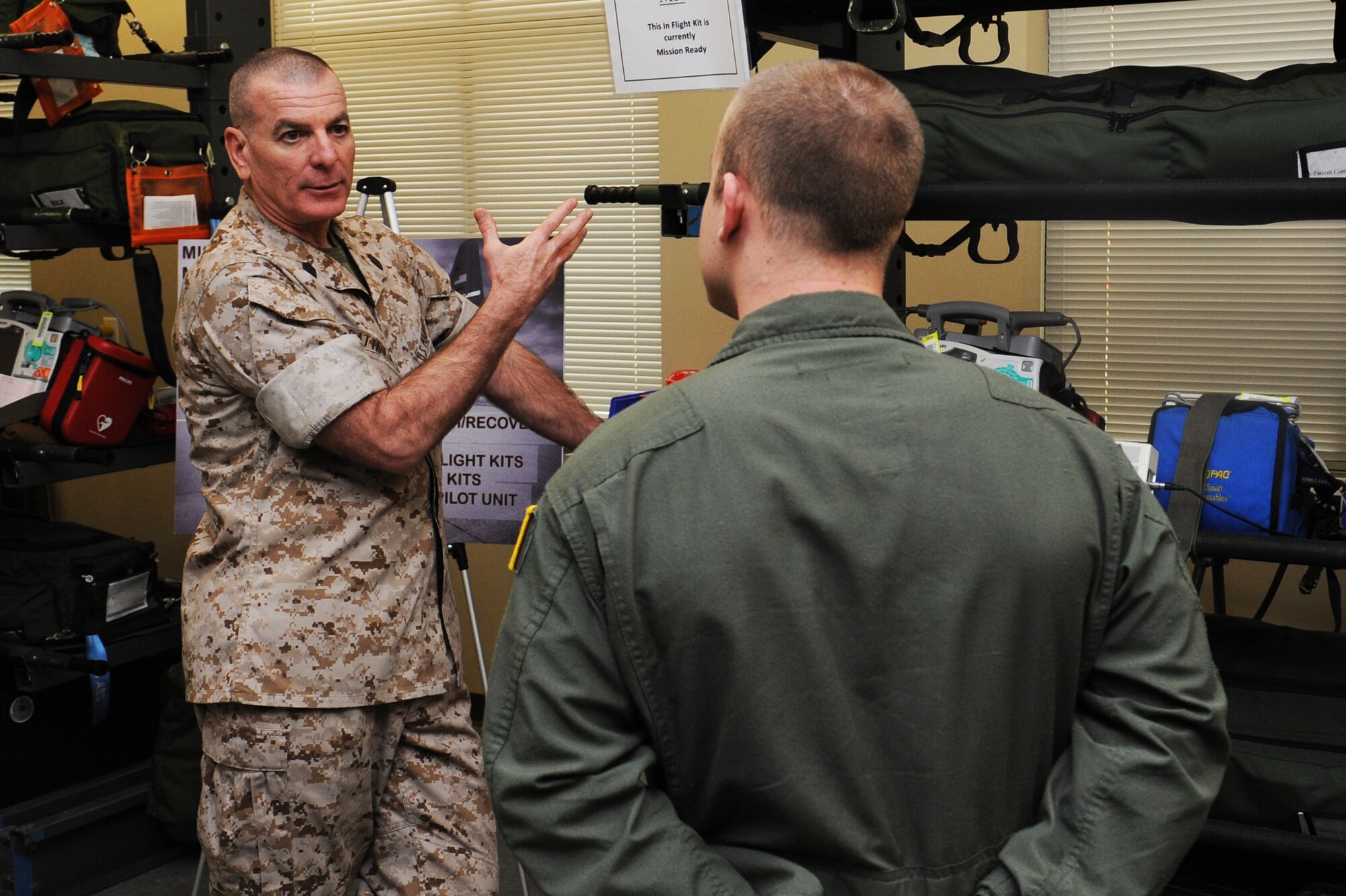 Marine Sgt. Maj. Bryan Battaglia learns about the equipment that Airmen are using at the 375th Aeromedical Evacuation Squadron, March 28, 2014, Scott Air Force Base, Ill. Battaglia received a mission brief and tour of the building. Battaglia is the Senior Enlisted Advisor to the Chairman of the Joint Chiefs of Staff. (U.S. Air Force photo/Airman 1st Class Megan Friedl)