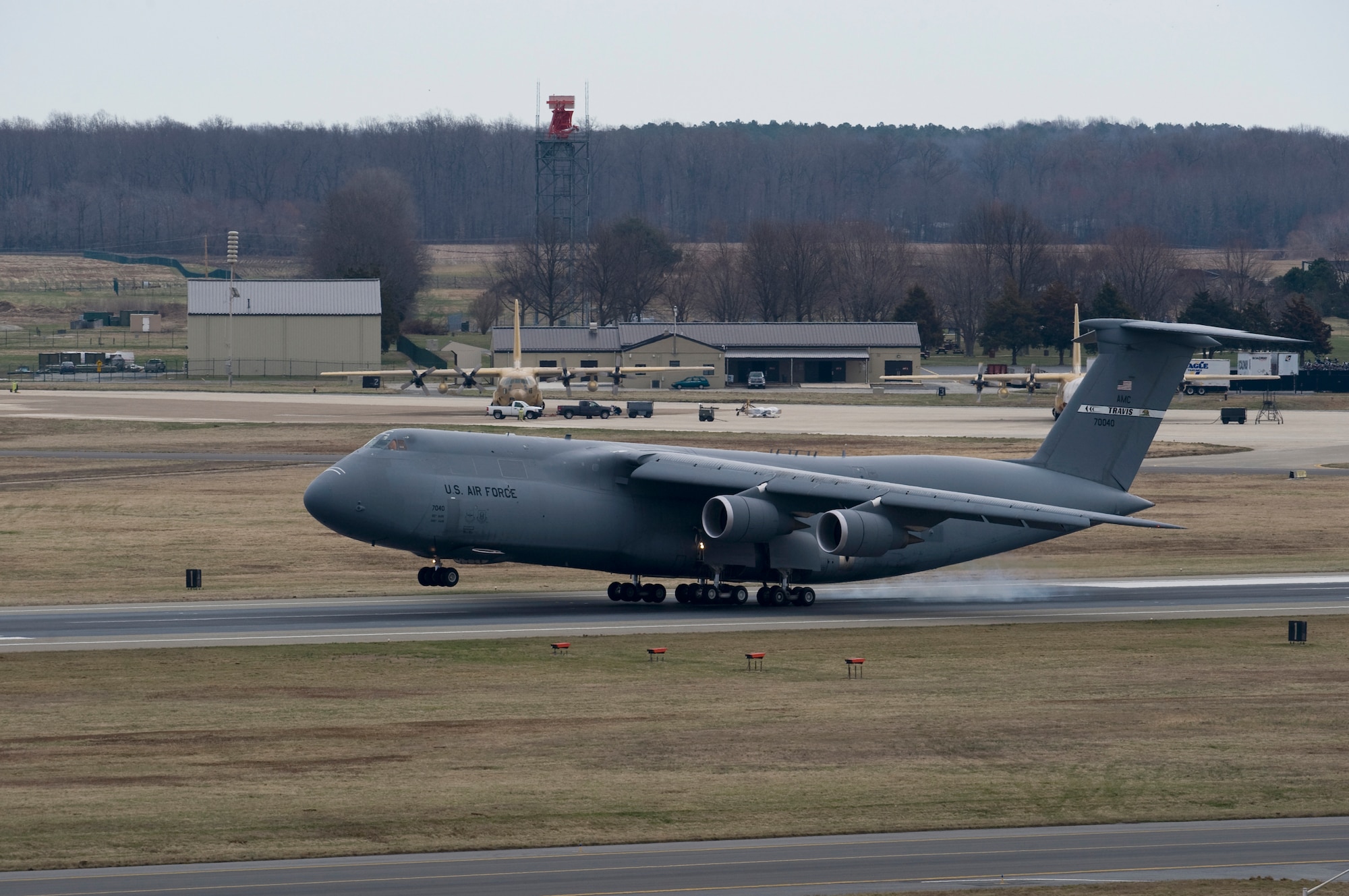 A C-5M Super Galaxy lands at Dover Air Force Base, Del., April 2, 2014. The C-5M, tail number 87-0040, was officially delivered to DAFB by Lt. Gen. Brooks L. Bash, Air Mobility Command vice commander. (U.S. Air Force photo/Staff Sgt. Elizabeth Morris))