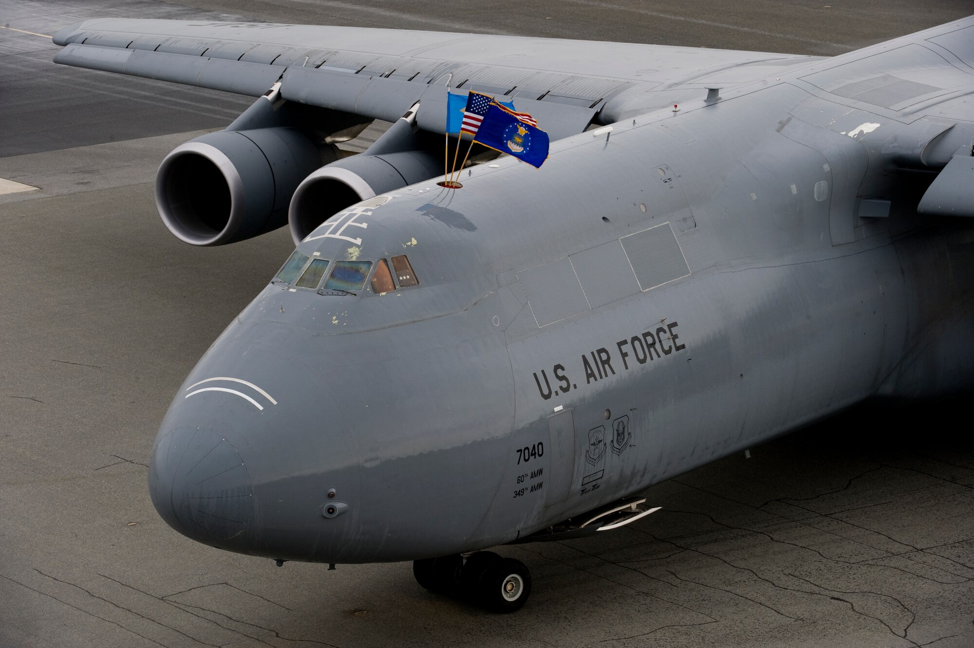 A C-5M Super Galaxy taxis to a parking spot after going through a customary spray-down on April 2, 2014, at Dover Air Force Base, Del. Lt. Gen. Brooks L. Bash, Air Mobility Command vice commander, served as the delivery official for Dover’s last assigned C-5M. (U.S. Air Force photo/Staff Sgt. Elizabeth Morris)