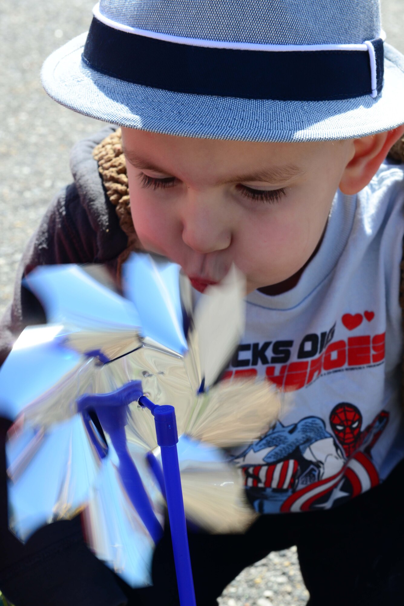 Four-year old Jaxson Pattinson, son of Staff Sgt. Jenna Pattinson, participated in planting pinwheels in honor of National Child Abuse Prevention Month, in front of the Child Development Center at Langley Air Force Base, Va., April 1, 2014. According to the Pinwheels for Prevention campaign, happy childhoods and bright futures are all that children deserve. (U.S. Air Force photo by Airman 1st Class Kimberly Nagle/Released)