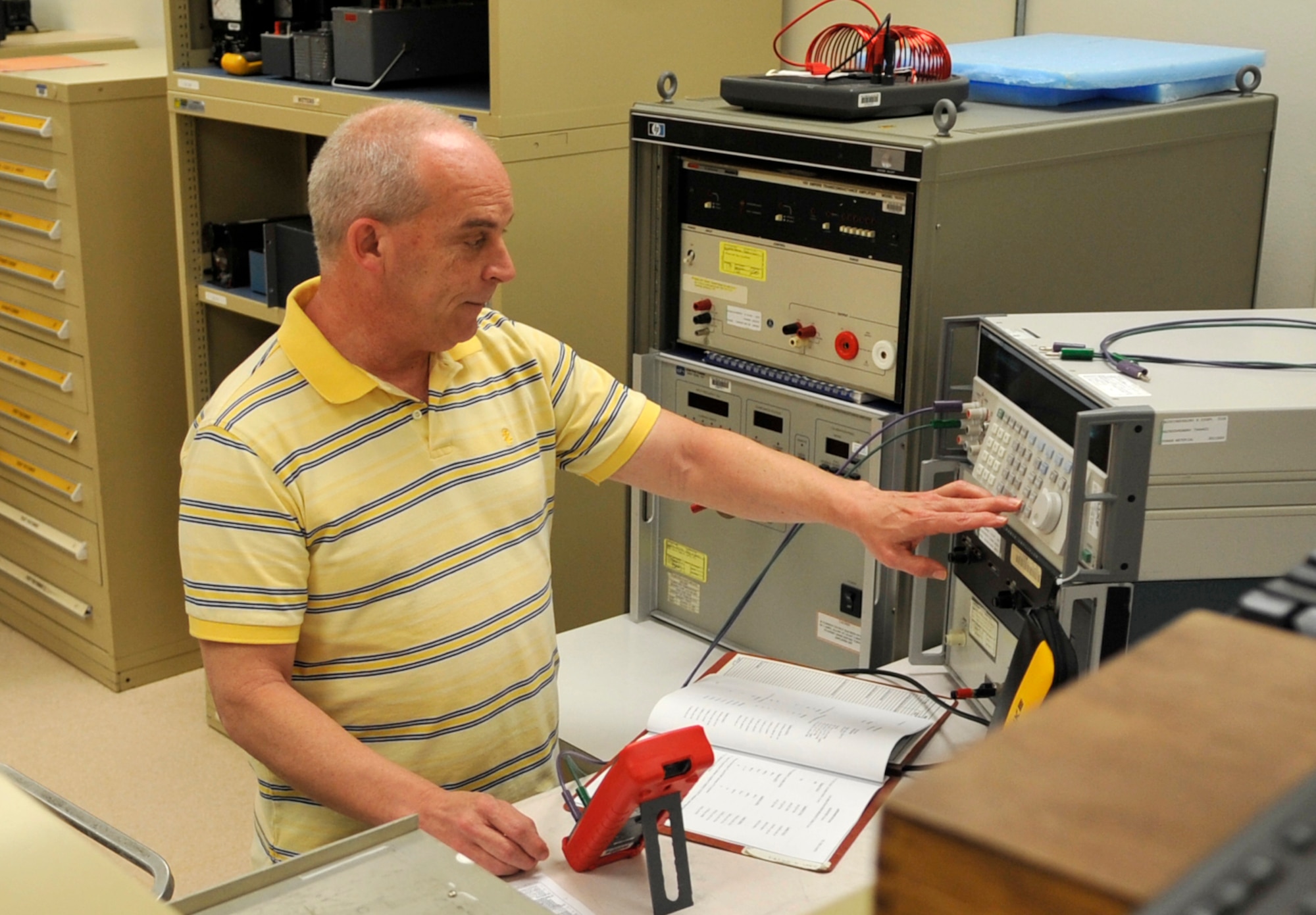 Mike Maxwell, 2nd Maintenance Squadron Precision Measurement Equipment Laboratory technician calibrates a multimeter on Barksdale Air Force Base, March 31, 2014. A multimeter measures the frequency and voltage of an electric current, and is calibrated on a regular basis. (U.S. Air Force photo/Airman 1st Class Benjamin Raughton)