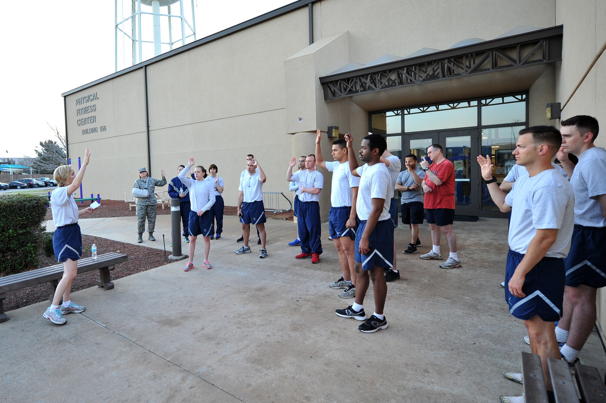 ALTUS AIR FORCE BASE, Okla. – U.S. Air Force Maj. Samantha Haberlach, 97th Comptroller Squadron commander, speaks with Airmen before a five-kilometer awareness run outside the Fitness Center April 2, 2014. Haberlach asked Airmen to raise their hand if they knew anyone who has been sexually assaulted and then gave sexual assault statistics to help emphasize the importance of Sexual Assault Awareness Month. (U.S. Air Force photo by Senior Airman Dillon Davis/Released)