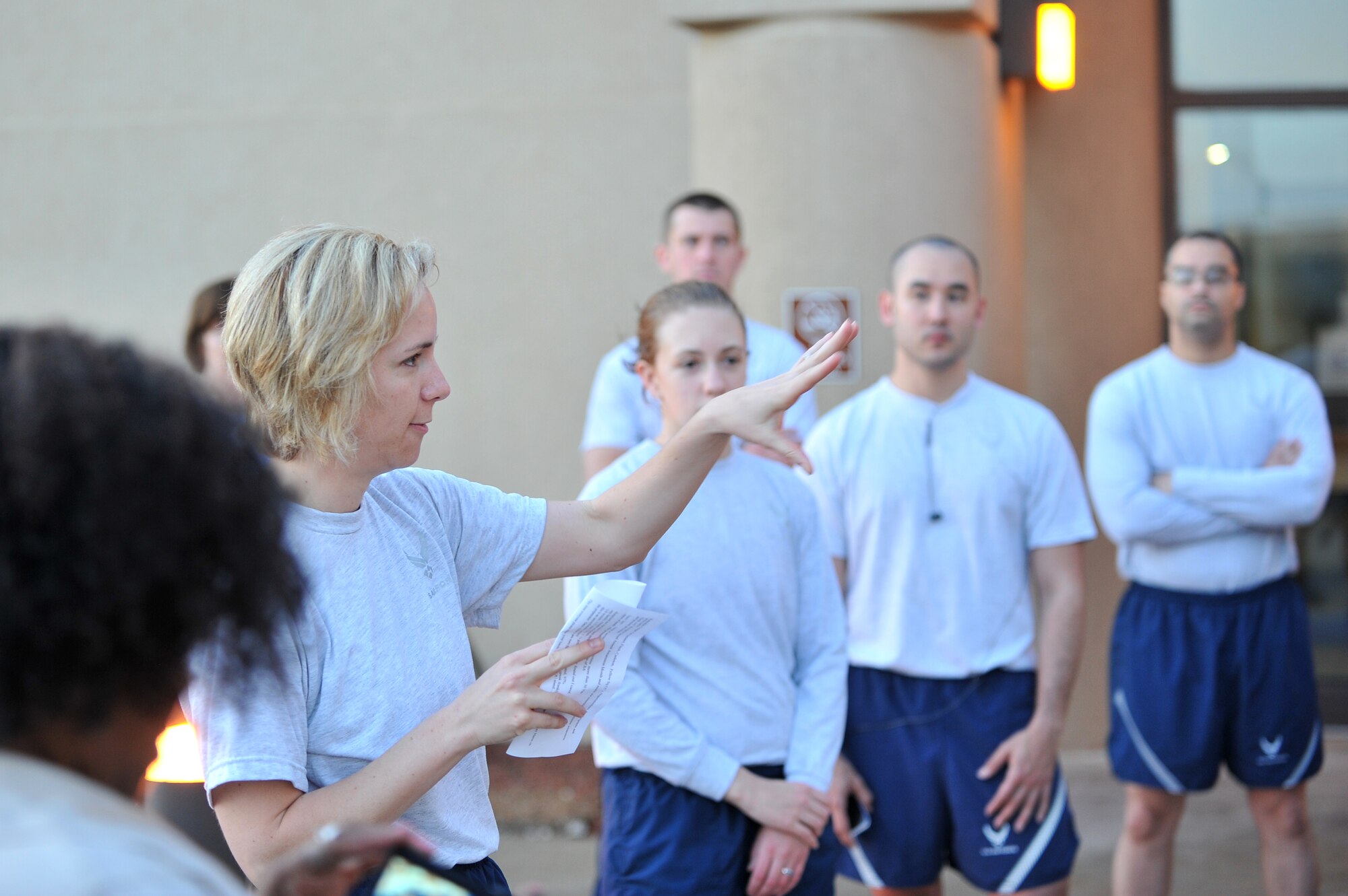 ALTUS AIR FORCE BASE, Okla. – U.S. Air Force Maj. Samantha Haberlach, 97th Comptroller Squadron commander, speaks to Airmen before a five-kilometer run outside the Fitness Center April 2, 2014. Haberlach spoke to Airmen about the importance of recognizing signs of sexual assault as part of Sexual Assault Awareness Month. (U.S. Air Force photo by Senior Airman Dillon Davis/Released)