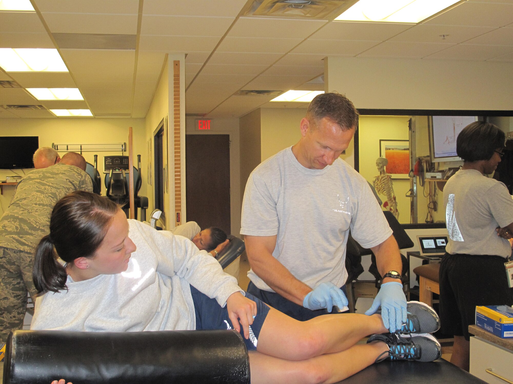 GOODFELLOW AI R FORCE BASE, Texas - Maj. Eric Stephan, 17th Medical Operations Squadron physical therapist, preforms dry needling on Capt. Jessica San Felippo, 81st Medical Support Group physical therapist, at the Ross Clinic here March 21. Trigger Point Dry Needling is typically done in physical therapy clinics, but the Goodfellow clinic decided to train clinicians in multiple departments to expand the reach of this treatment option. (U.S. Air Force photo/ Tech. Sgt. Curtrell Gibson)