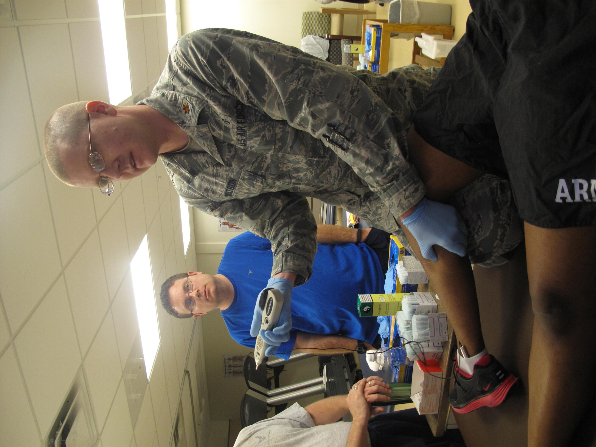 GOODFELLOW AIR FORCE BASE, Texas -- Maj. Daniel Watson, 7th Medical Operations Squadron physical therapist, demonstrates dry needling at the Ross Clinic here March 21. Trigger Point Dry Needling differs from acupuncture in that the latter is based on Eastern medical diagnosis, requiring training in traditional Chinese medicine. (U.S. Air Force photo/ Tech. Sgt. Curtrell Gibson)